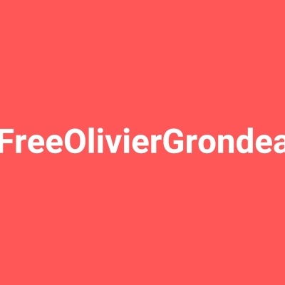 Image avec le texte # Free Olivier Grondeau sur fond rouge